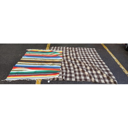 139 - A native American blanket, a vintage brown and white check blanket, a small Chinese mat, a Kelim mat... 