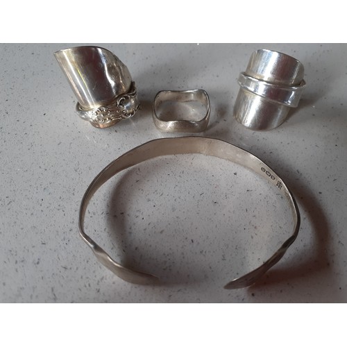 124 - Two silver rings fashioned from 2 vintage silver teaspoons dated 1944 and 1966, created by Twisted S... 