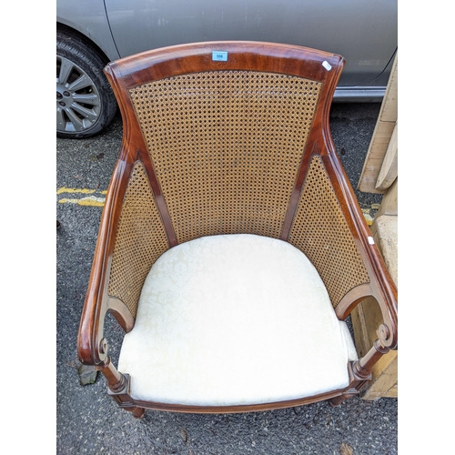 506 - A reproduction of a Regency mahogany bergère chair, with cushions on turned legs
Location: A1B
If th... 