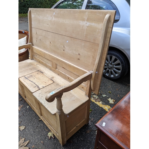 507 - A 19th century pine monks bench with a panelled back and box seat, top down 78cm h x 152cm w
Locatio... 