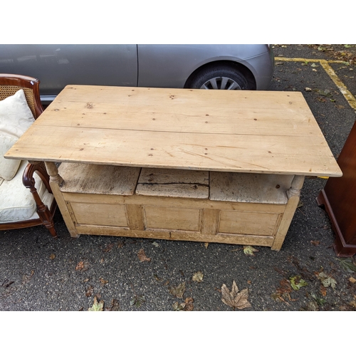 507 - A 19th century pine monks bench with a panelled back and box seat, top down 78cm h x 152cm w
Locatio... 