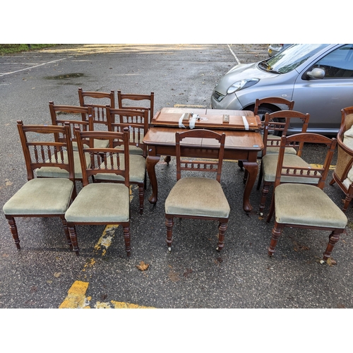 510 - An early 20th century mahogany extending dining table, on cabriole legs, 73cm h x 105cm l and two ad... 