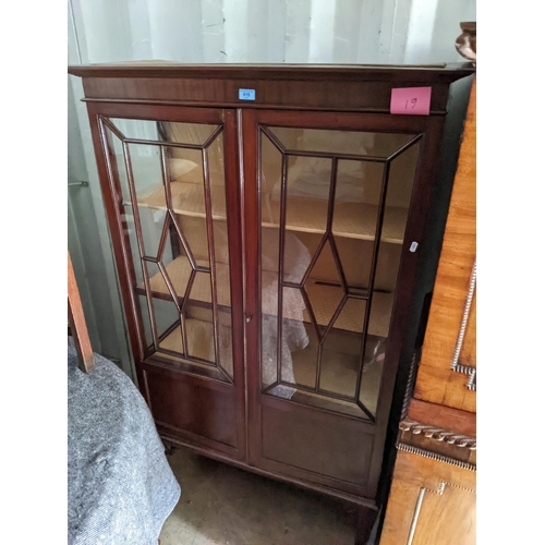 515 - An Edwardian mahogany display cabinet with twin part glazed doors, on square legs
Location: RED CON
... 