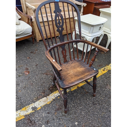 523 - A 19th century ash Windsor chair with a pierced splat back and solid seat
Location: RED CON
If there... 