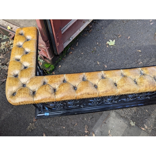 530 - A mid 20th century black painted wrought iron club fender with a button leather upholstered top
Loca... 