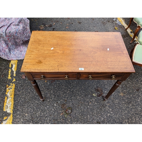 534 - An early 19th century mahogany side table with two drawers, on turned legs, 75cm h x 92cm w
Location... 