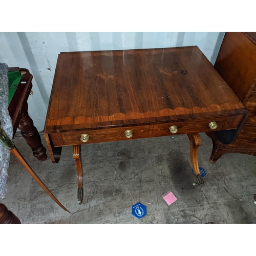 536 - A Regency inlaid mahogany sofa table with twin drawers, on sabre legs and brass sabbots
Location: RE... 