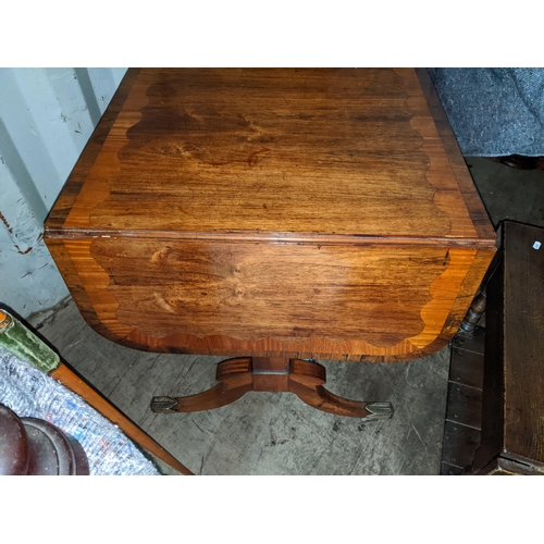 536 - A Regency inlaid mahogany sofa table with twin drawers, on sabre legs and brass sabbots
Location: RE... 