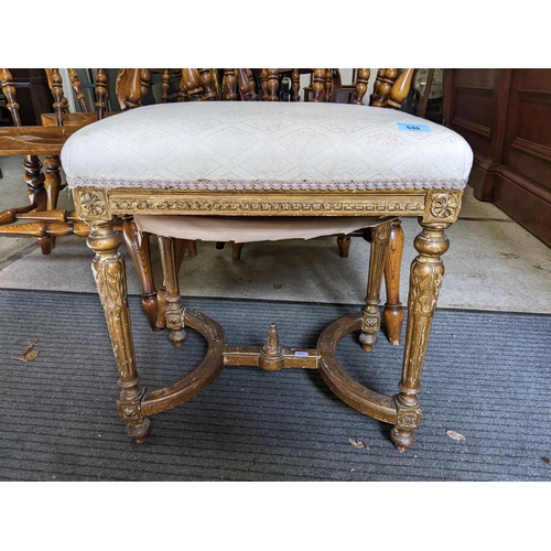 540 - A 19th century gilt wood stool with an upholstered top, on turned fluted legs, 52cm h x 50cm w
Locat... 