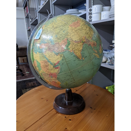 570 - A mid 20th century Philips Challenge Globe, on a wooden stand, 46cm h
Location: ROS
If there is no c... 