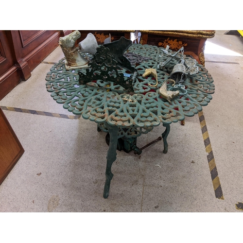 571 - A green painted metal garden table a shoe scraper, a bell in the form of a horse head and another
Lo... 