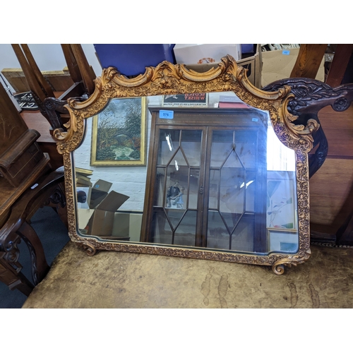 576 - A 20th century gesso framed mirror with floral ornament, 61 cm h, 77cm w
Location: RAB
If there is n... 