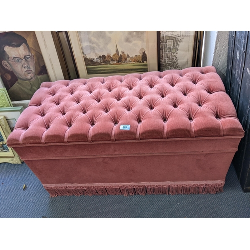 578 - A modern pink button upholstered chest with a hinged top
Location: RWF
If there is no condition repo... 