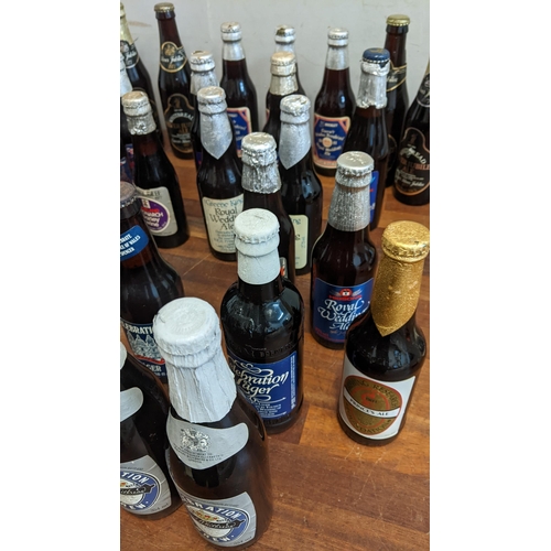 408 - A collection of 35 commemorative beers to include Whitbread Celebration Brew commemorating the 1981 ... 