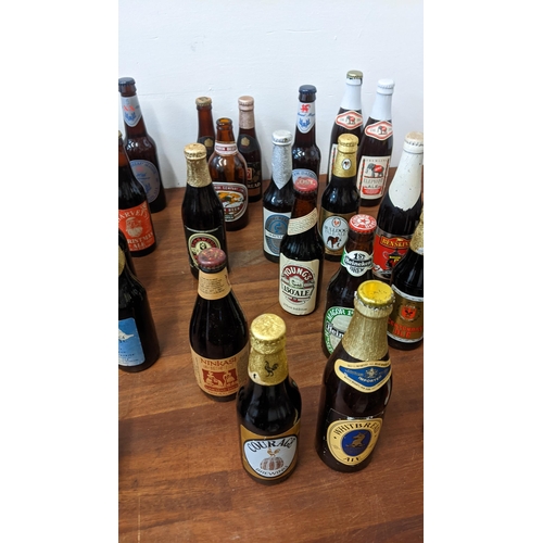 409 - A collection of 61 unopened beer bottles from breweries in the UK and from around the world to inclu... 