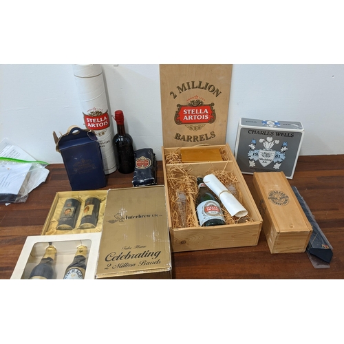 410 - A collection of commemorative beer related items to include Stella Artois 2 Million Barrels box, a W... 