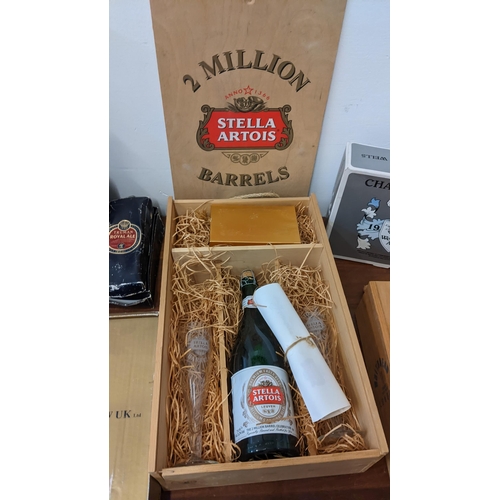 410 - A collection of commemorative beer related items to include Stella Artois 2 Million Barrels box, a W... 