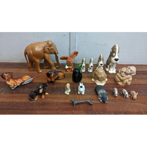 479 - A collection of mostly ceramic miniature animals to include four Szeiler 'Sad Sam' basset hound figu... 