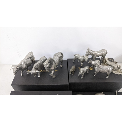 485 - A collection of mostly pewter miniature animals to include a pewter horse, kangaroo,, pig, a militar... 