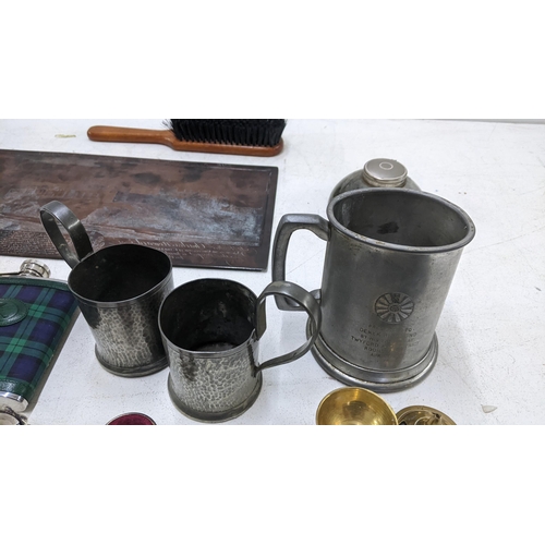 580 - A collection of metalware to include a tartan covered hip flask, a pewter tankard, an inkwell, a can... 