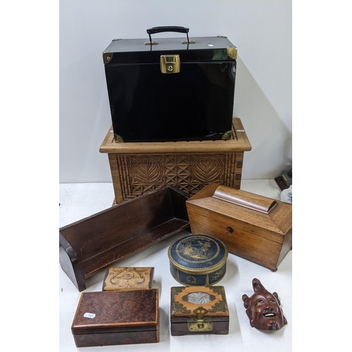 584 - A collection of storage boxes to include a tea caddy, a cigarette box, a miniature wooden pew, a car... 