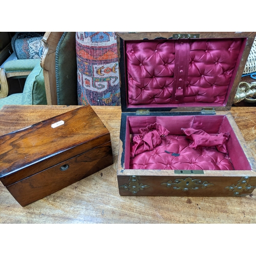 445 - A Victorian walnut sewing/work box with brass strapwork and mounts, the top with agate cabochon, sil... 