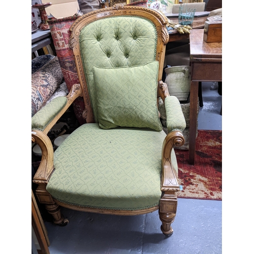 543 - A Victorian satin walnut upholstered open armchair, carved and engraved style decoration with scroll... 