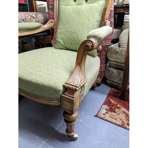 543 - A Victorian satin walnut upholstered open armchair, carved and engraved style decoration with scroll... 