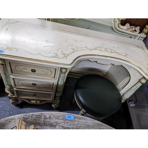 554 - A painted cream coloured dressing table with floral painted decoration, green and gilt highlights, t... 