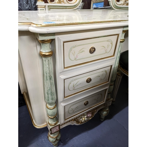 554 - A painted cream coloured dressing table with floral painted decoration, green and gilt highlights, t... 