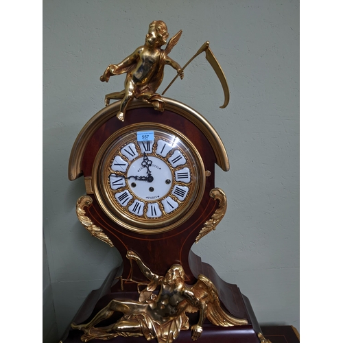 557 - An ornate and large Palais Royale Paris mechanical clock, 87cm high, the mahogany case with inlaid s... 