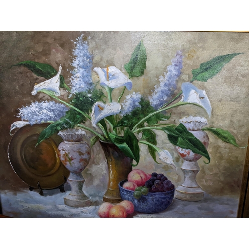 567 - A 20th century still life of Calla lily and Hyacinth flowers in a vase, fruit to one side, vases and... 