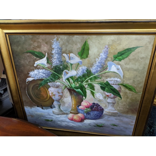 567 - A 20th century still life of Calla lily and Hyacinth flowers in a vase, fruit to one side, vases and... 