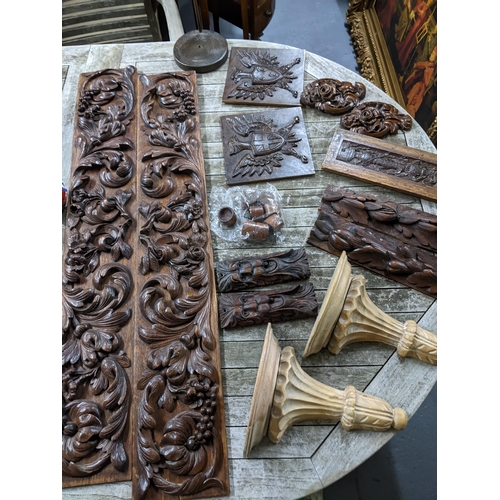 450 - A selection of carved wooden plaques to include a pair with relief carved scrolled leaf, flower head... 