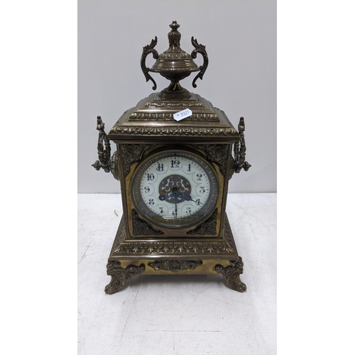 67 - A brass composition French mantel clock with an Arabic dial Location: 1.4
If there is no condition r... 