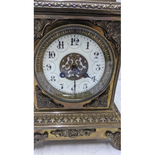 67 - A brass composition French mantel clock with an Arabic dial Location: 1.4
If there is no condition r... 