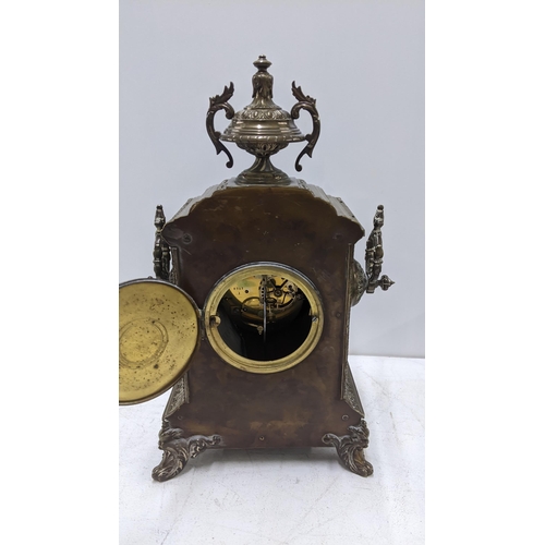 67 - A brass composition French mantel clock with an Arabic dial Location: 1.4
If there is no condition r... 