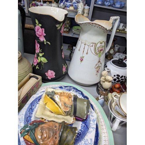 588 - A mixed lot of china and ceramics to include two twin handled vases, a large water jug and other ite... 