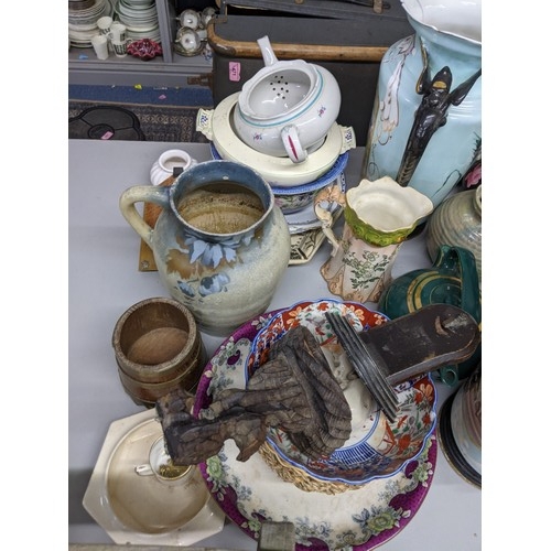 588 - A mixed lot of china and ceramics to include two twin handled vases, a large water jug and other ite... 