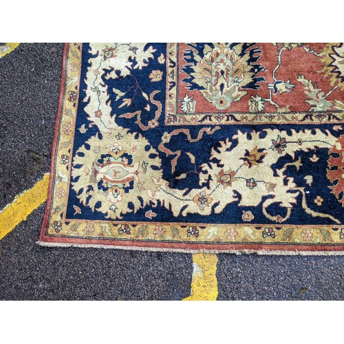 133 - A 20th century hand woven Agra carpet, floral decoration on a red ground
Location: G
If there is no ... 