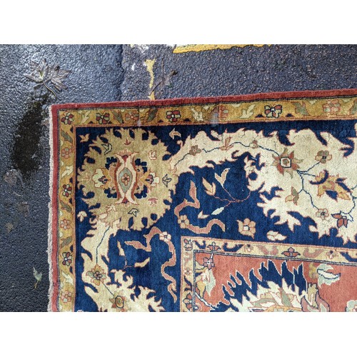 133 - A 20th century hand woven Agra carpet, floral decoration on a red ground
Location: G
If there is no ... 