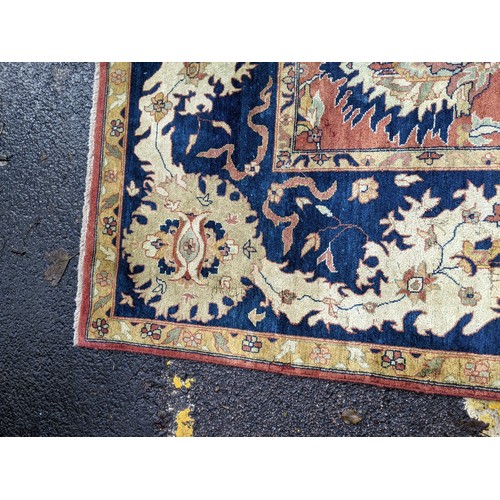 133 - A 20th century hand woven Agra carpet, floral decoration on a red ground
Location: G
If there is no ... 