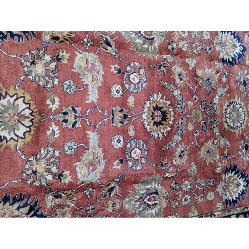 133 - A 20th century hand woven Agra carpet, floral decoration on a red ground
Location: G
If there is no ... 