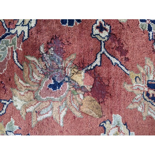 133 - A 20th century hand woven Agra carpet, floral decoration on a red ground
Location: G
If there is no ... 