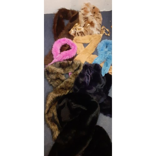 51 - A quantity of 20th Century fur and faux fur stoles in various colours to include a Dents black faux ... 