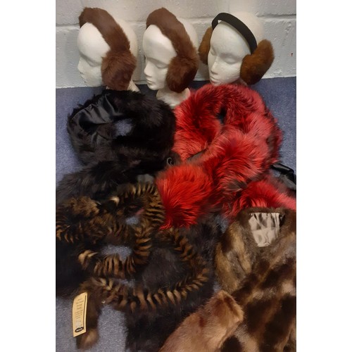 51 - A quantity of 20th Century fur and faux fur stoles in various colours to include a Dents black faux ... 