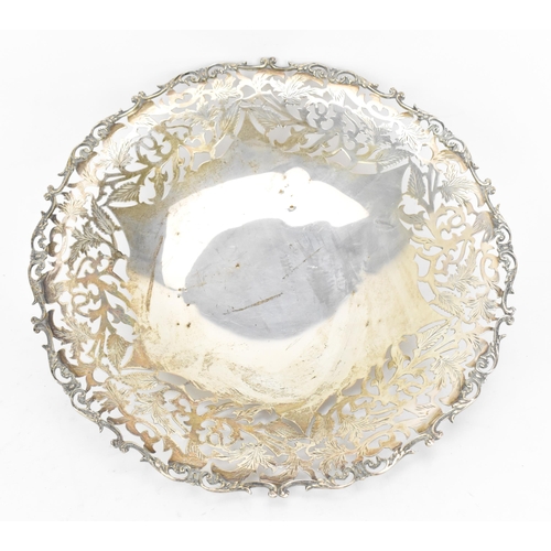 163 - A Continental white metal pierced fruit bowl, circa 1900s, the pierced border with scrolled foliage,... 