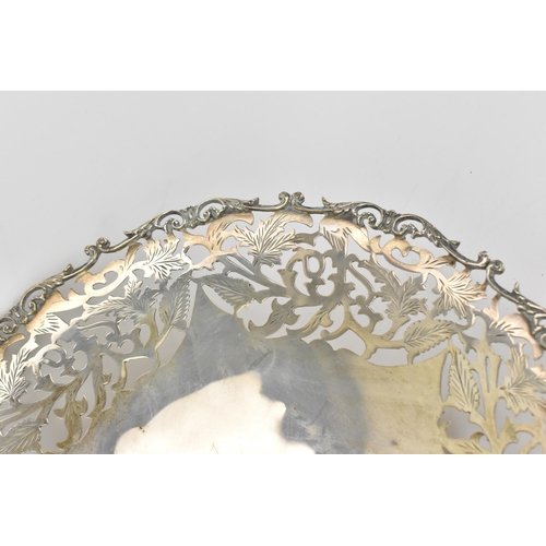 163 - A Continental white metal pierced fruit bowl, circa 1900s, the pierced border with scrolled foliage,... 