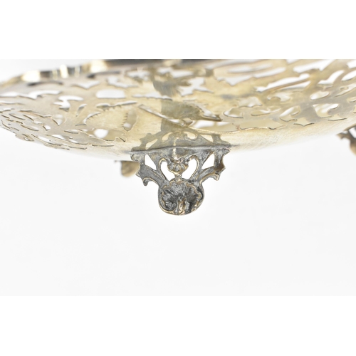 163 - A Continental white metal pierced fruit bowl, circa 1900s, the pierced border with scrolled foliage,... 