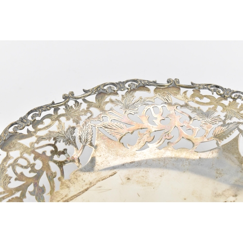 163 - A Continental white metal pierced fruit bowl, circa 1900s, the pierced border with scrolled foliage,... 